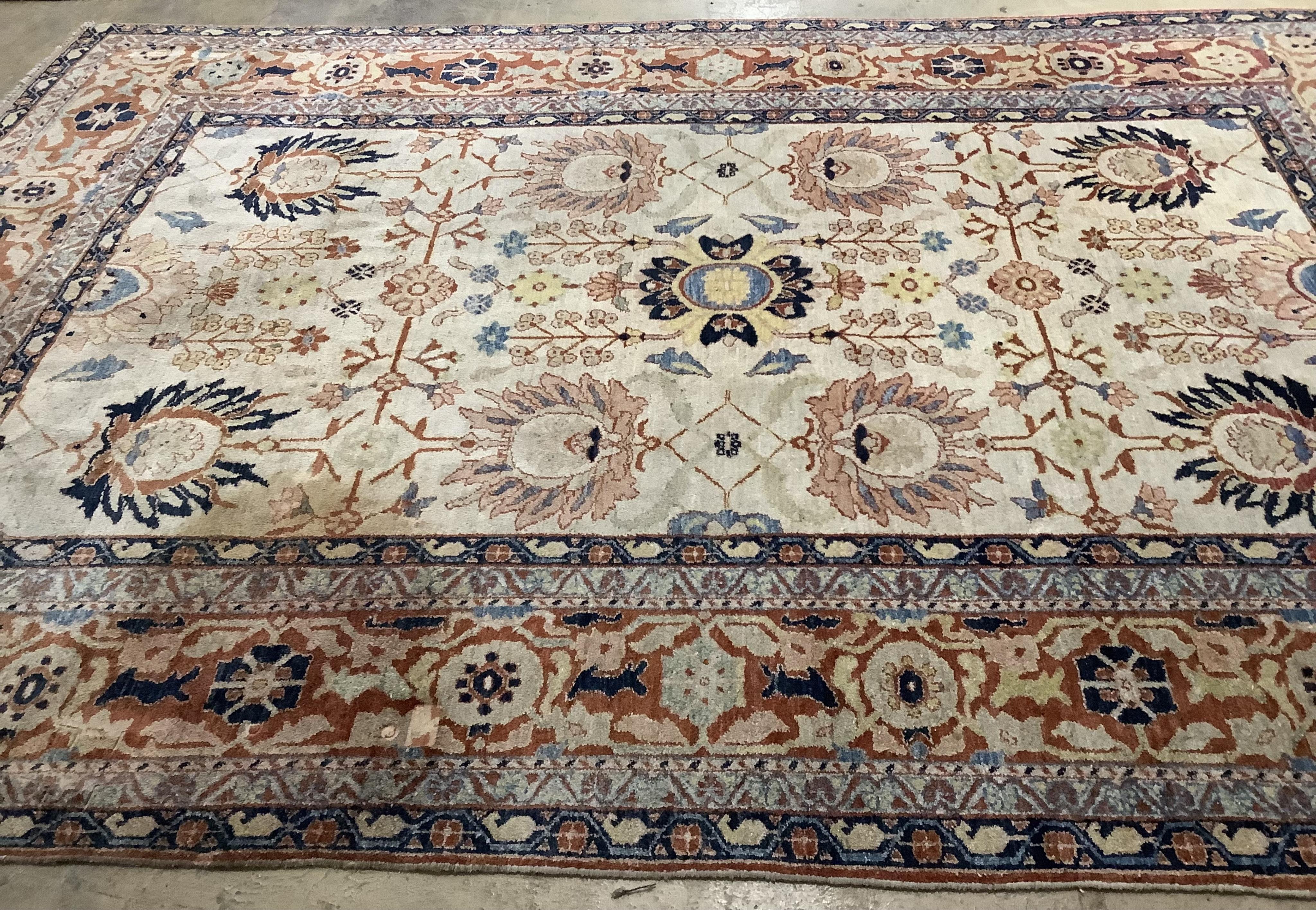 A Garous Zeigler style ivory ground carpet, 358 x 260cm. Condition - fair, one stained patch